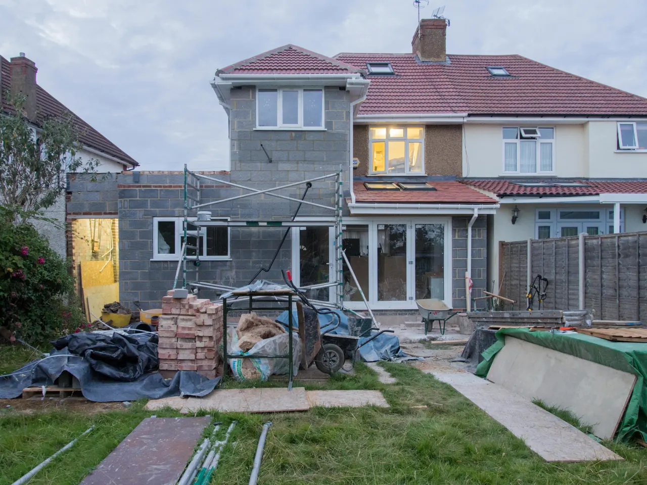 A house exterior with construction work and building materials